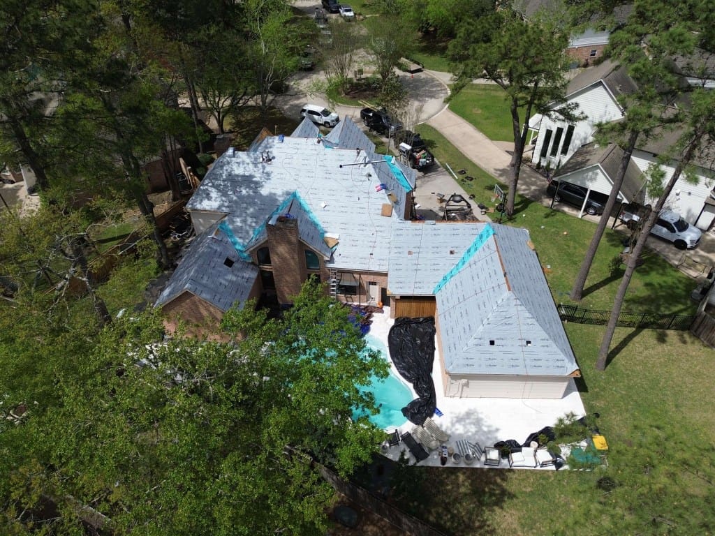 Synthetic roofing underlayment being installed on Houston home